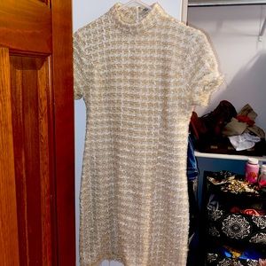 Knitted mock neck fitted dress. Subtle sequins.